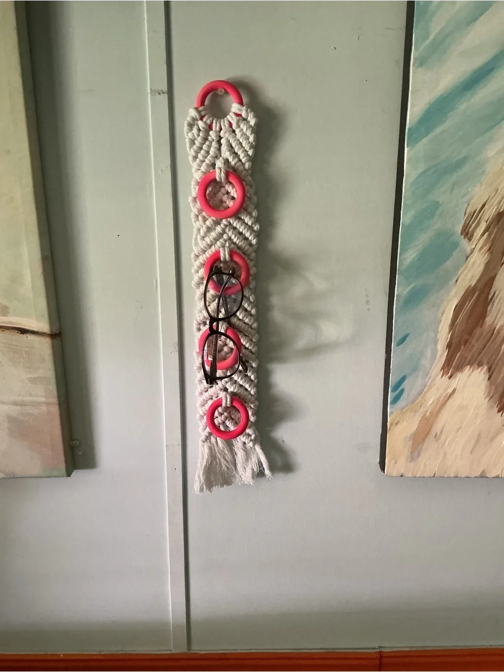 Handmade White Macramé Wall Organizer with Pink Rings